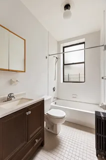 a bathroom with a sink toilet a mirror and vanity