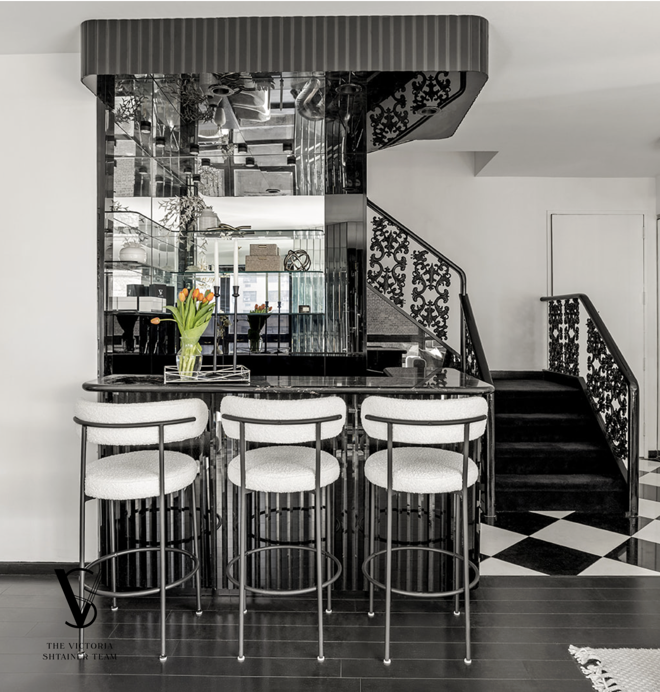415 East 54th Street, Unit 6D Manhattan, NY 10022 - Photo 5 of 18 a kitchen with a dining table chairs and white cabinets