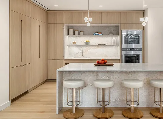 20 River Terrace, Unit 10G Manhattan, NY 10282 - Photo 13 of 21 a kitchen with a sink and chairs