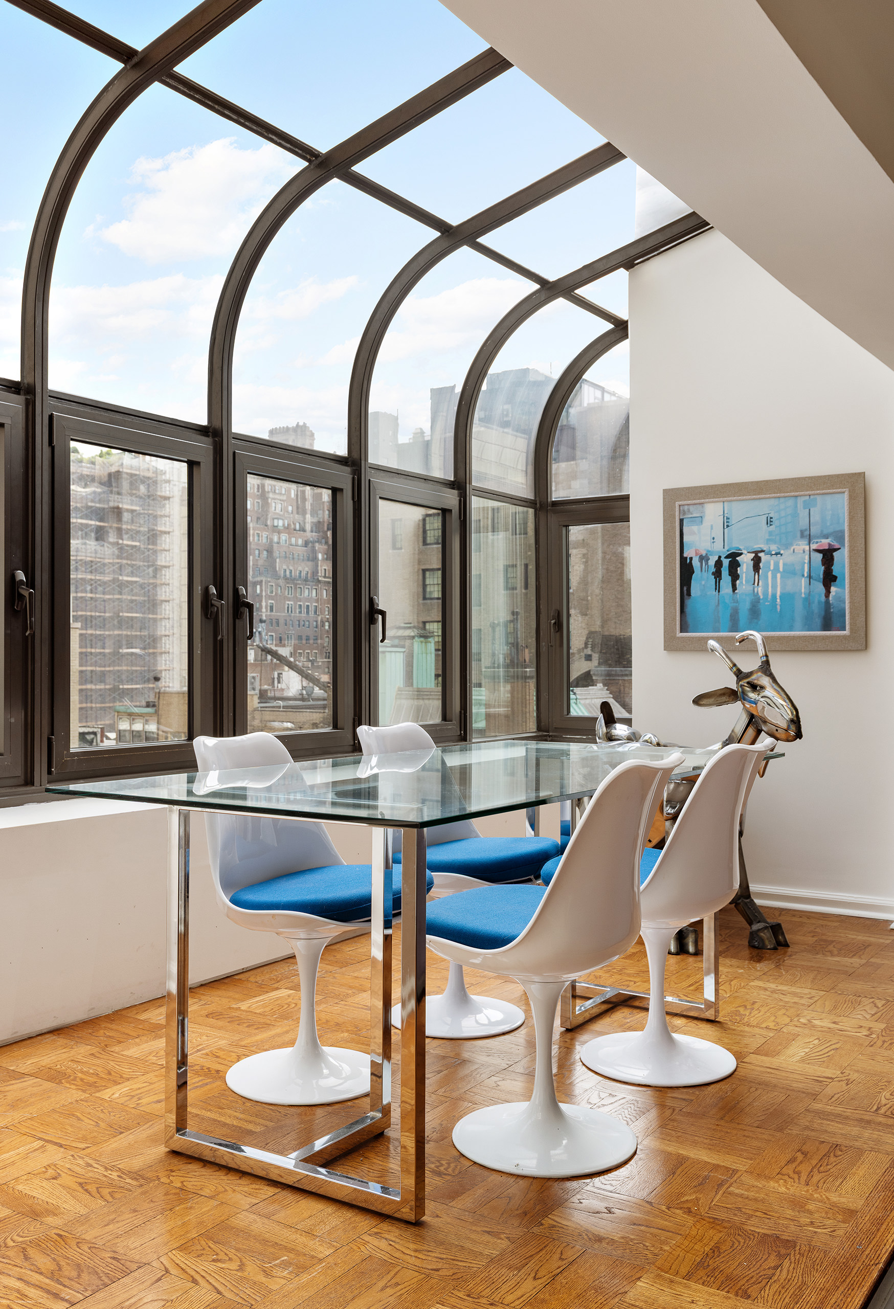 860 5th Avenue, Unit 11E Manhattan, NY 10065 - Photo 4 of 9 a room with lots of chairs and view of wooden floor