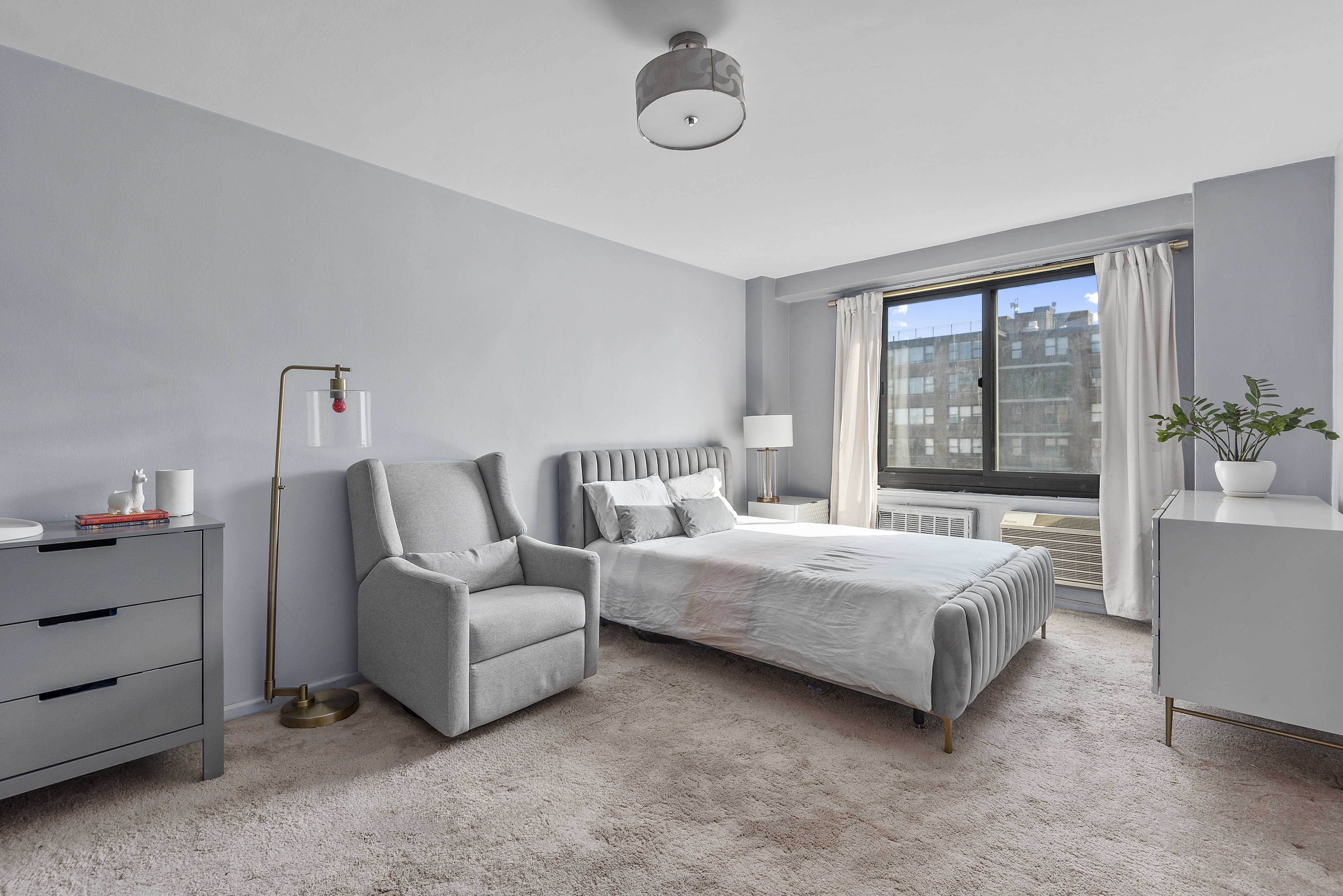195 Willoughby Avenue, Unit 1411 Brooklyn, NY 11205 - Photo 4 of 6 a living room with furniture and a large window