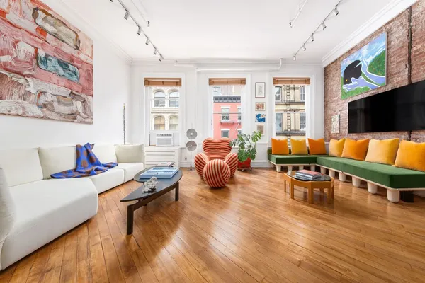 a living room with furniture and a flat screen tv