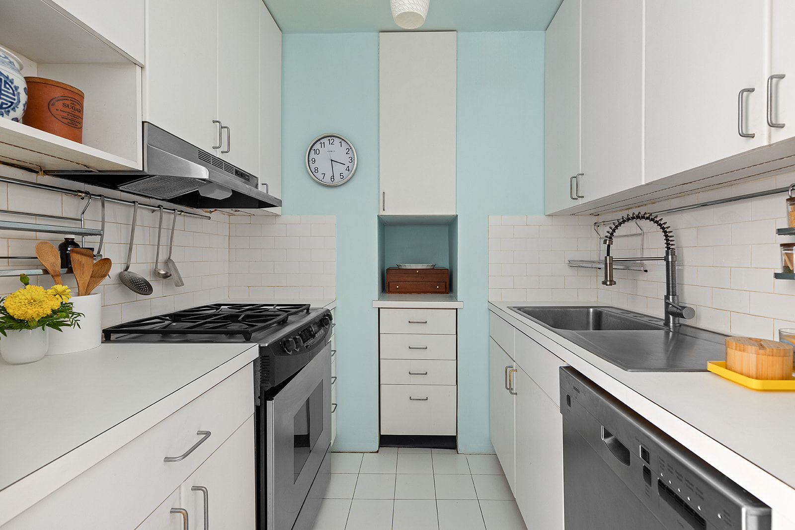 343 East 30th Street, Unit 12M Manhattan, NY 10016 - Photo 3 of 9 a kitchen with stainless steel appliances granite countertop a sink stove and cabinets