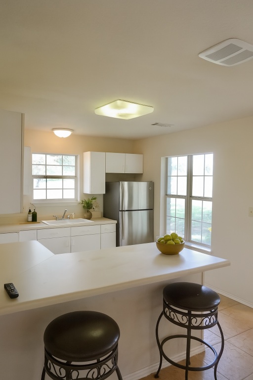 111 Trinity Street Cedar Creek, TX 78612 - Photo 38 of 38 a kitchen with a table and chairs