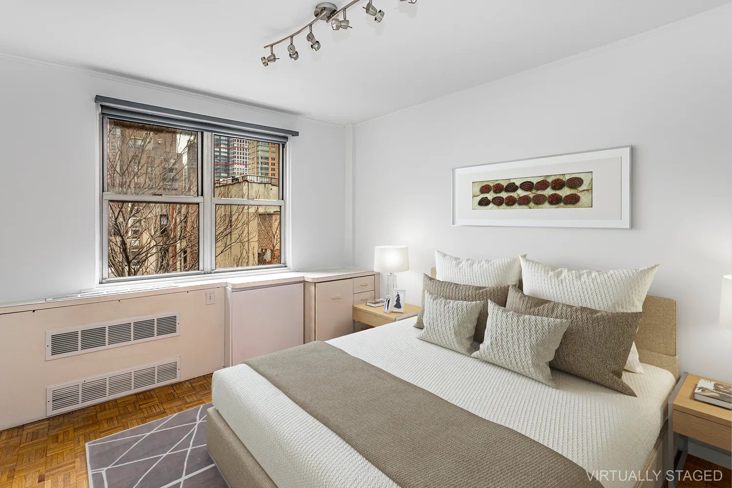 a bedroom with a bed and a large window