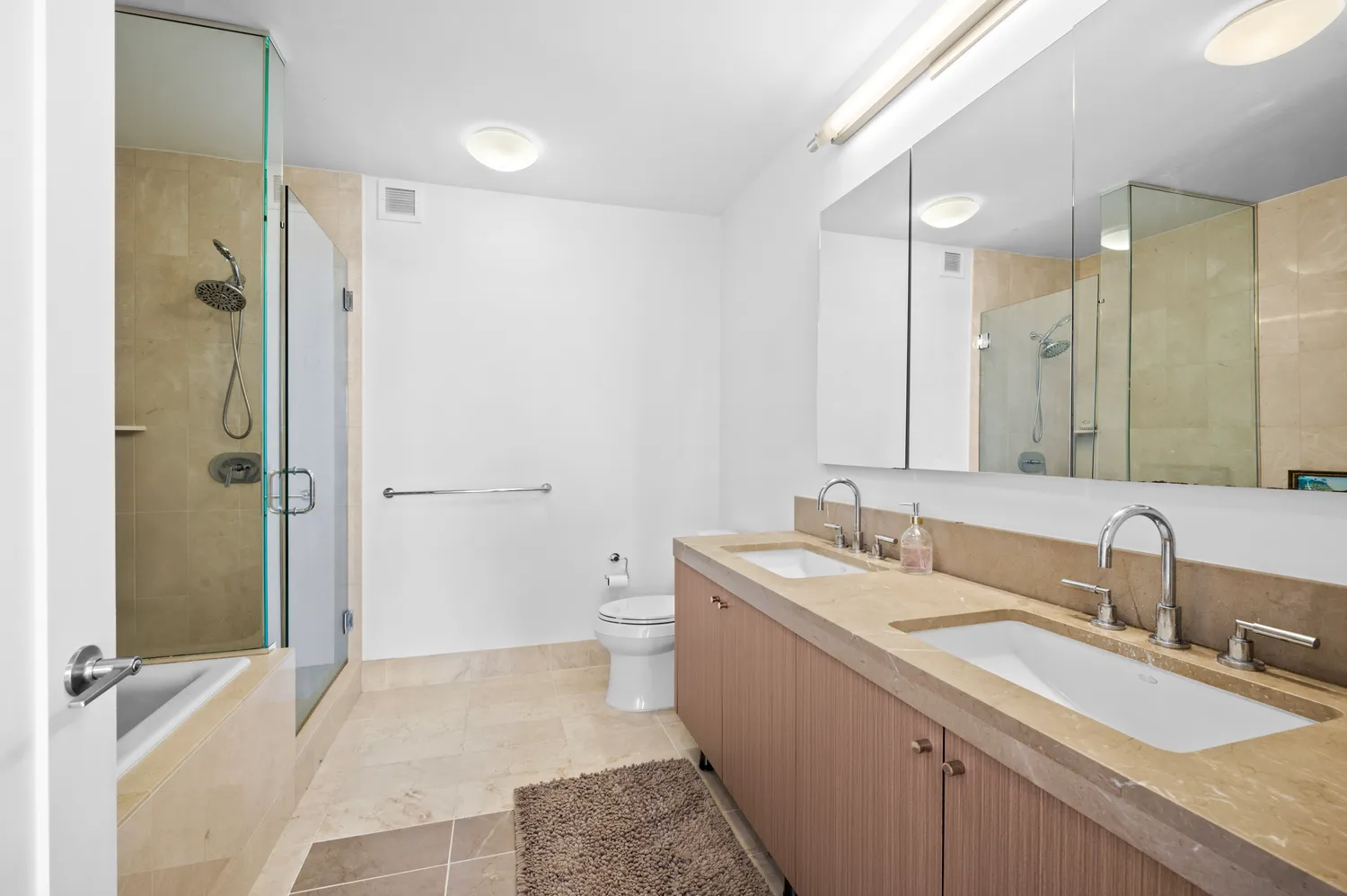 a bathroom with a sink double vanity and a mirror