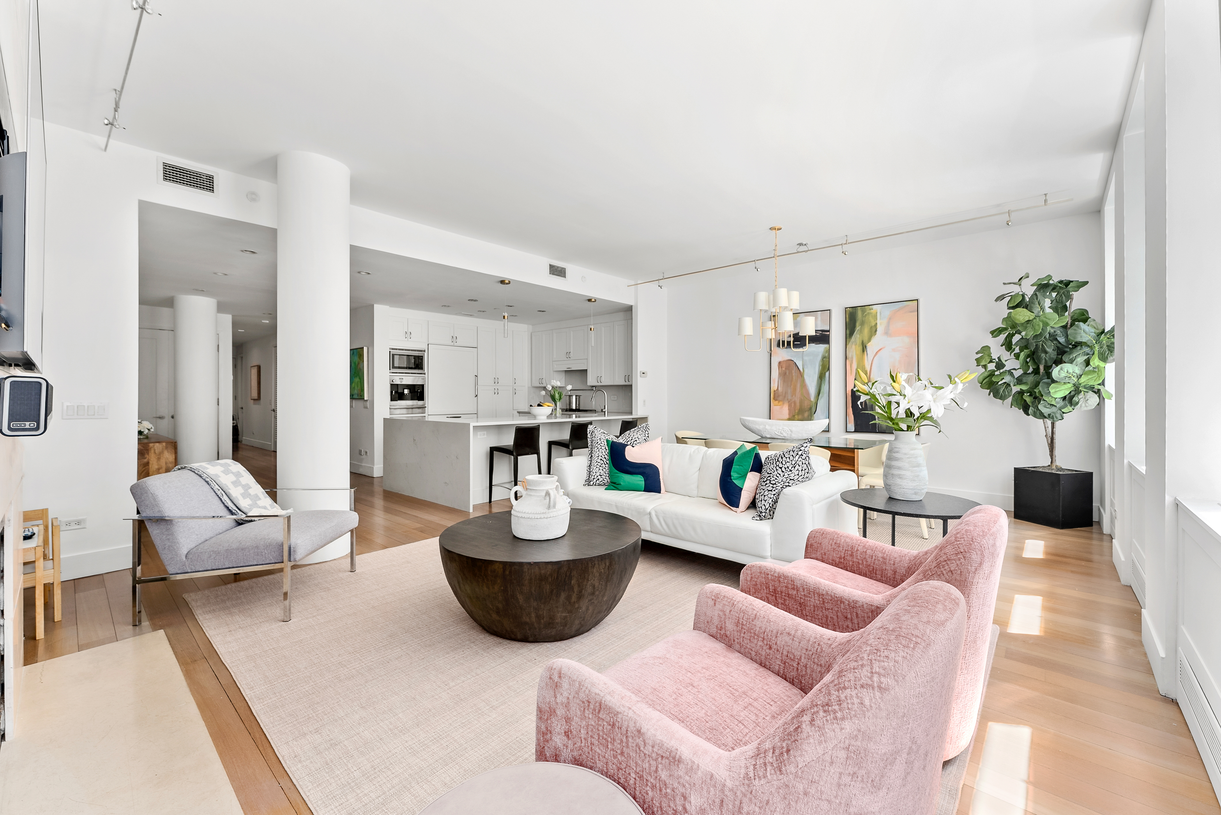 15 West 20th Street, Unit 9A Manhattan, NY 10011 - Photo 2 of 21 a living room with furniture a rug and a chandelier