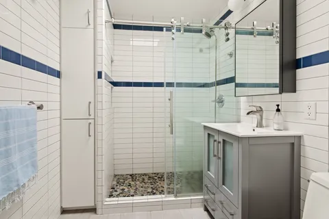 a kitchen with a stove a sink and a refrigerator