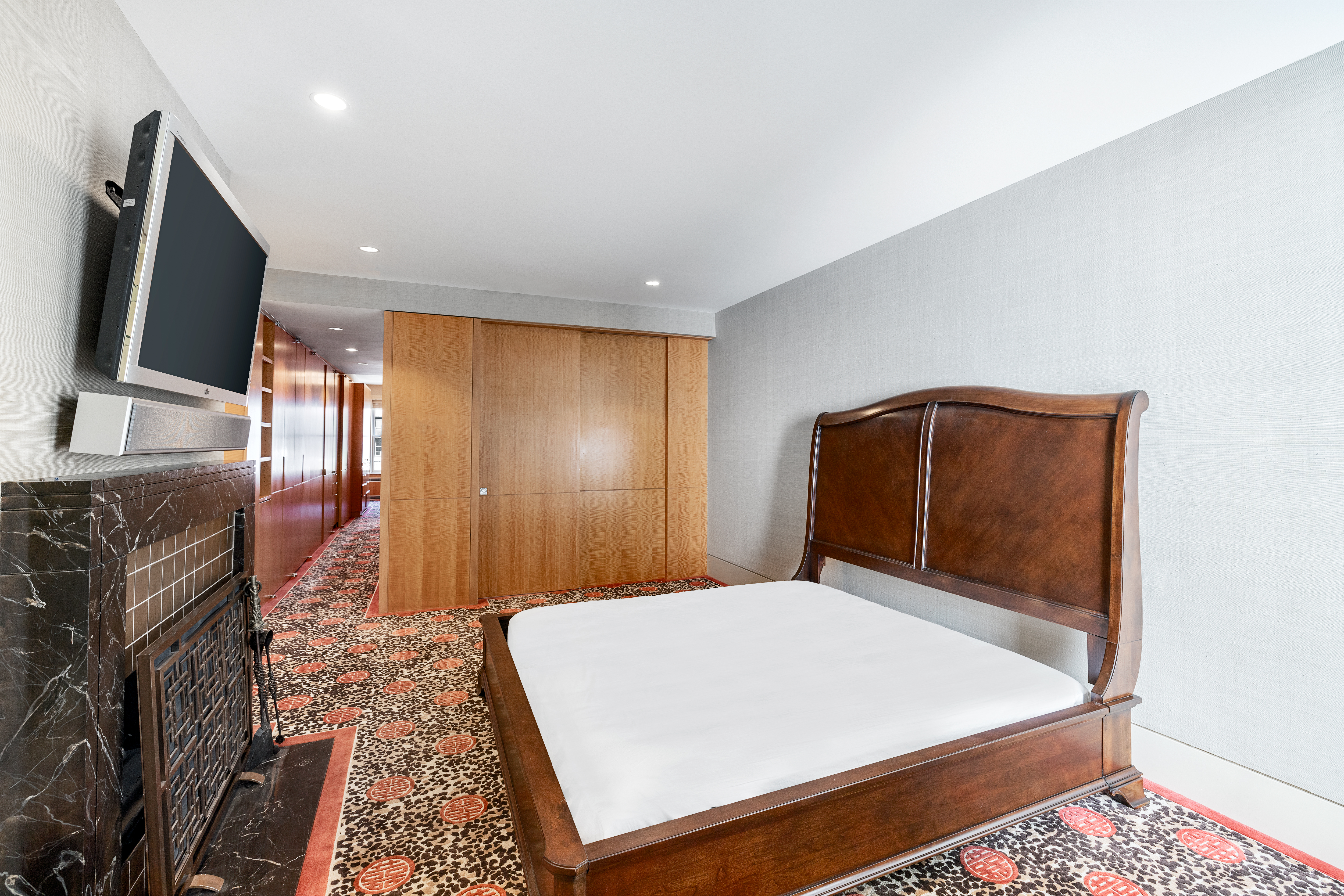 22 East 78th Street Manhattan, NY 10075 - Photo 17 of 23 a bedroom with a bed and a flat screen tv