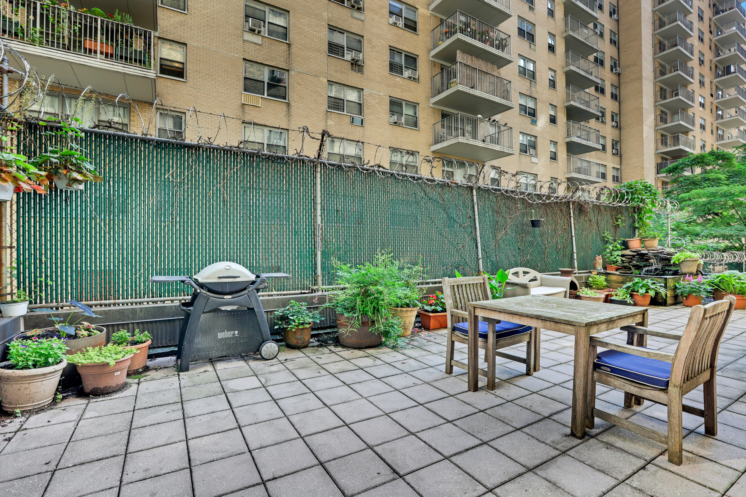 41 West 96th Street, Unit 1B Manhattan, NY 10025 - Photo 23 of 24 a view of an outdoor sitting area with a chairs and plants