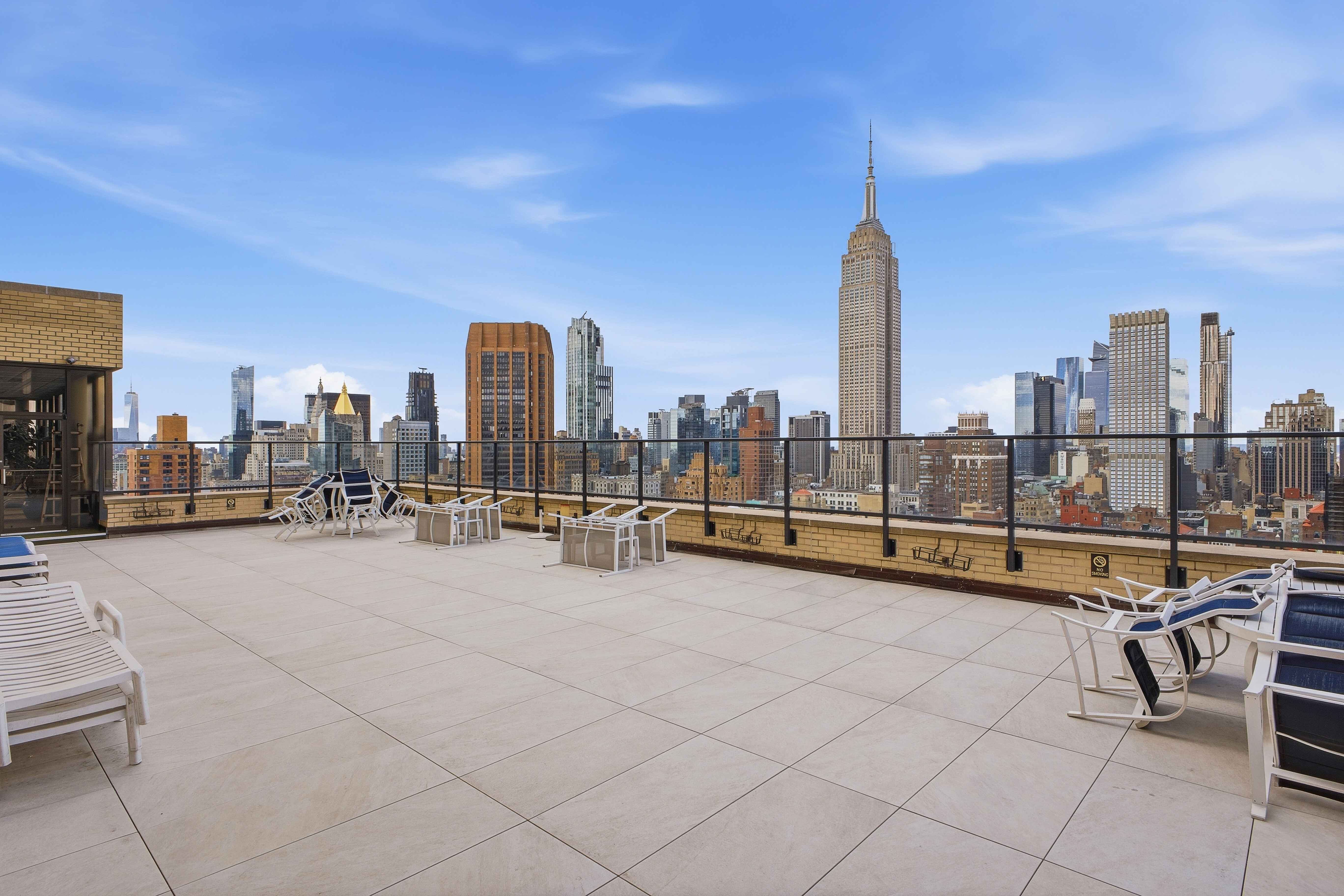 160 East 38th Street, Unit 26FG Manhattan, NY 10016 - Photo 20 of 23 a view of a terrace with chairs