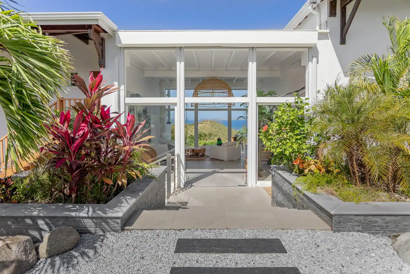 Anse Marcel St. Martin, undefined 97150 - Photo 13 of 15 a potted plant sitting in front of a house