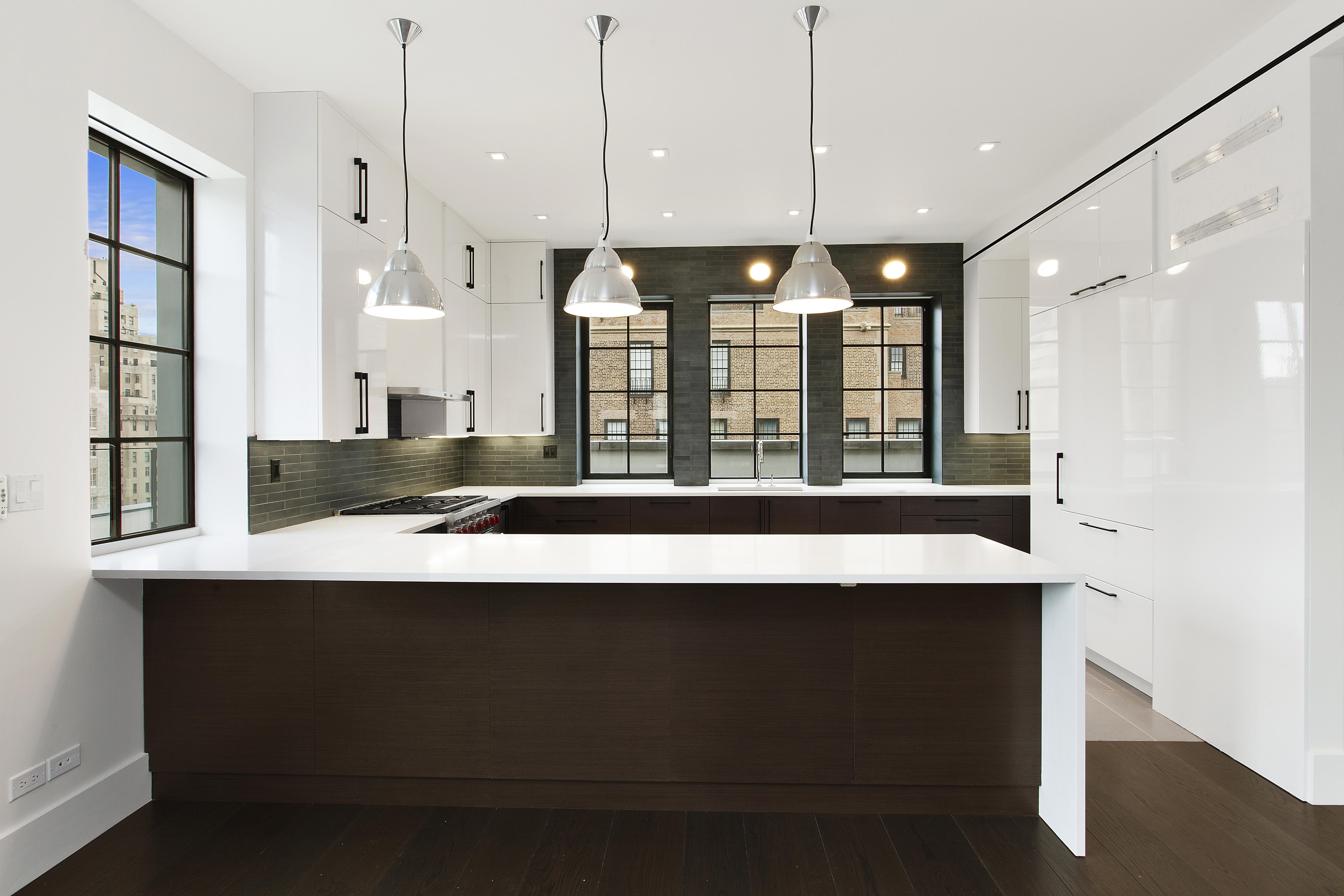 East 80th Street Manhattan, NY 10075 - Photo 3 of 13 a kitchen with a refrigerator a sink and wooden floor