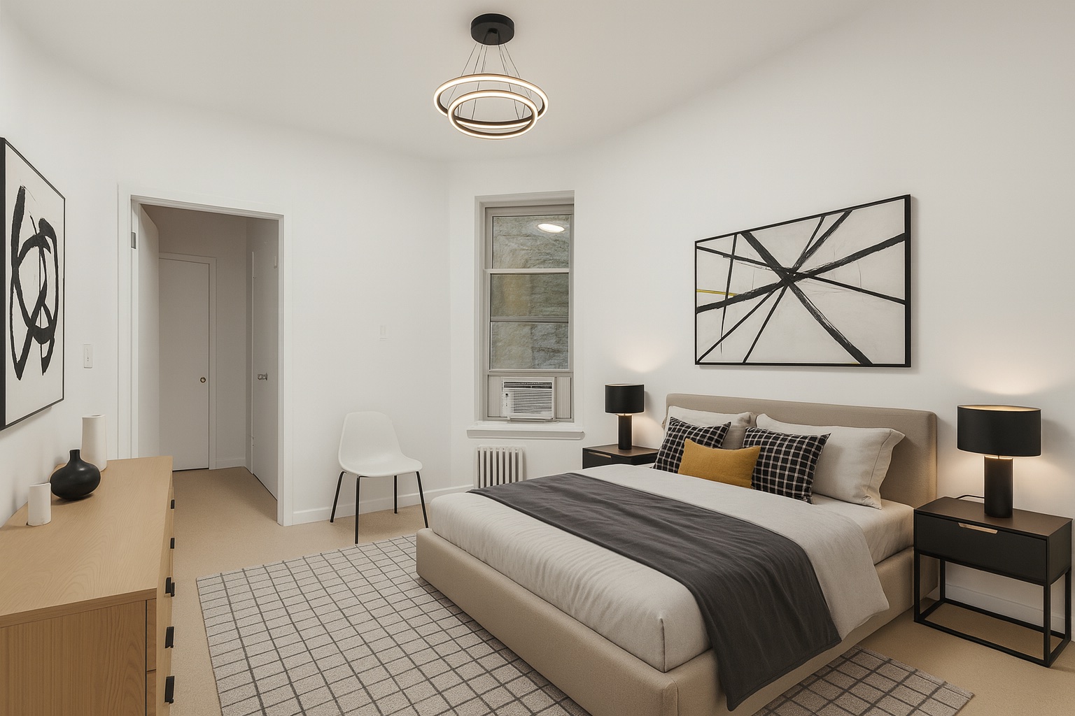 323 West 43rd Street, Unit 4R Manhattan, NY 10036 - Photo 7 of 14 a bedroom with a bed and a lamp on dresser