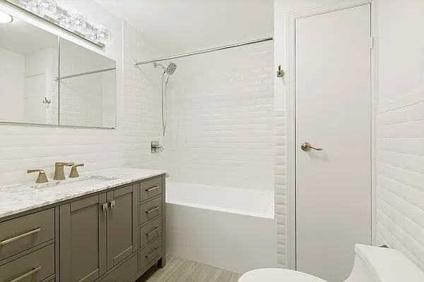 6 Murray Street, Unit 2 Manhattan, NY 10007 - Photo 3 of 7 a bathroom with a granite countertop sink toilet and shower