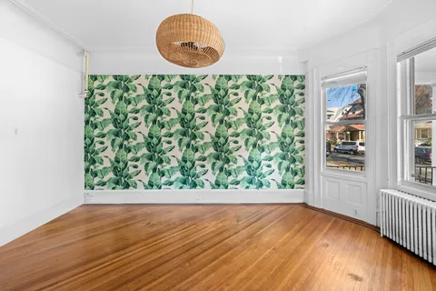 an empty room with wooden floor