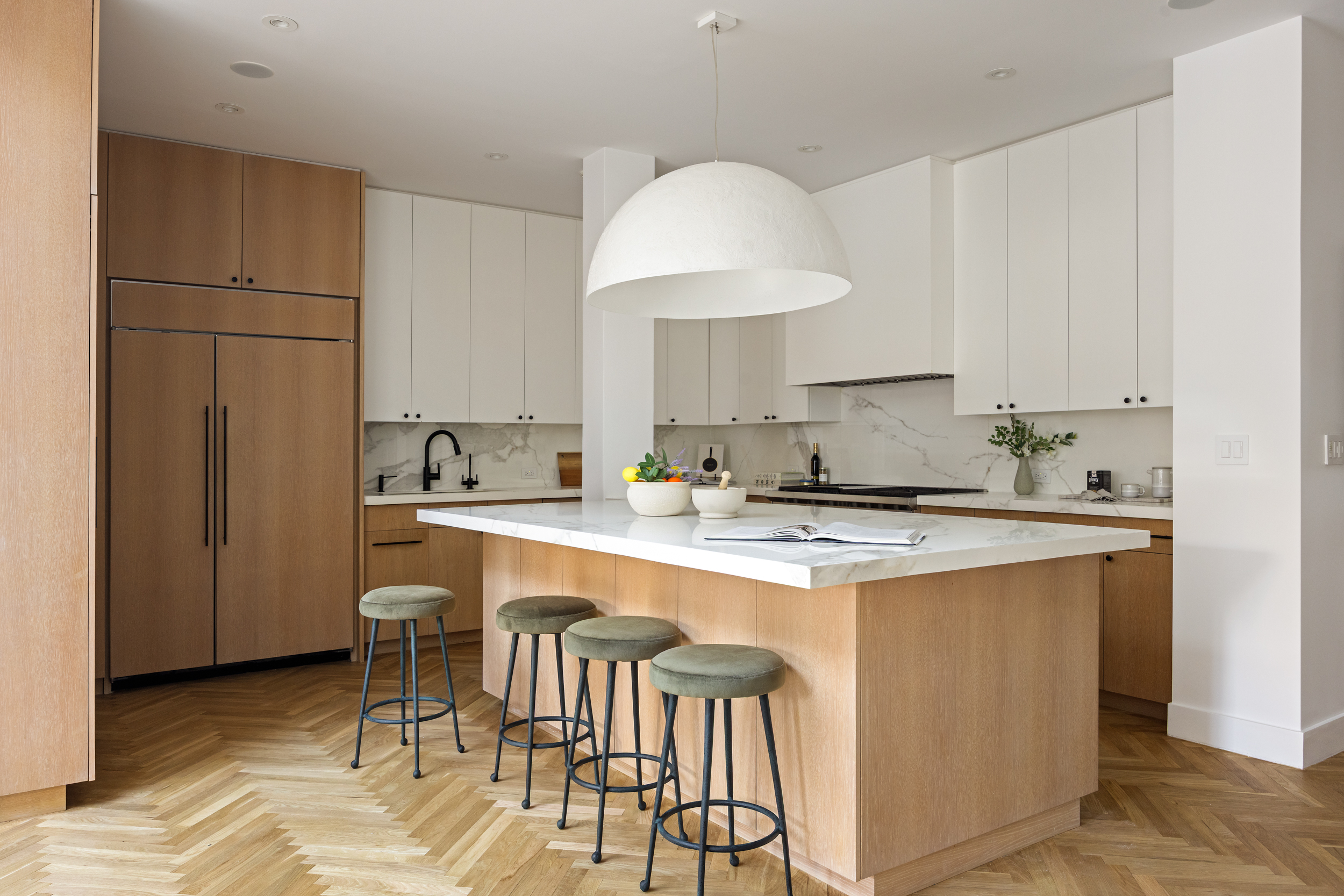 45 Warren Street, Unit PH Manhattan, NY 10007 - Photo 11 of 29 a kitchen with stainless steel appliances granite countertop a sink a stove a refrigerator and island with wooden floor