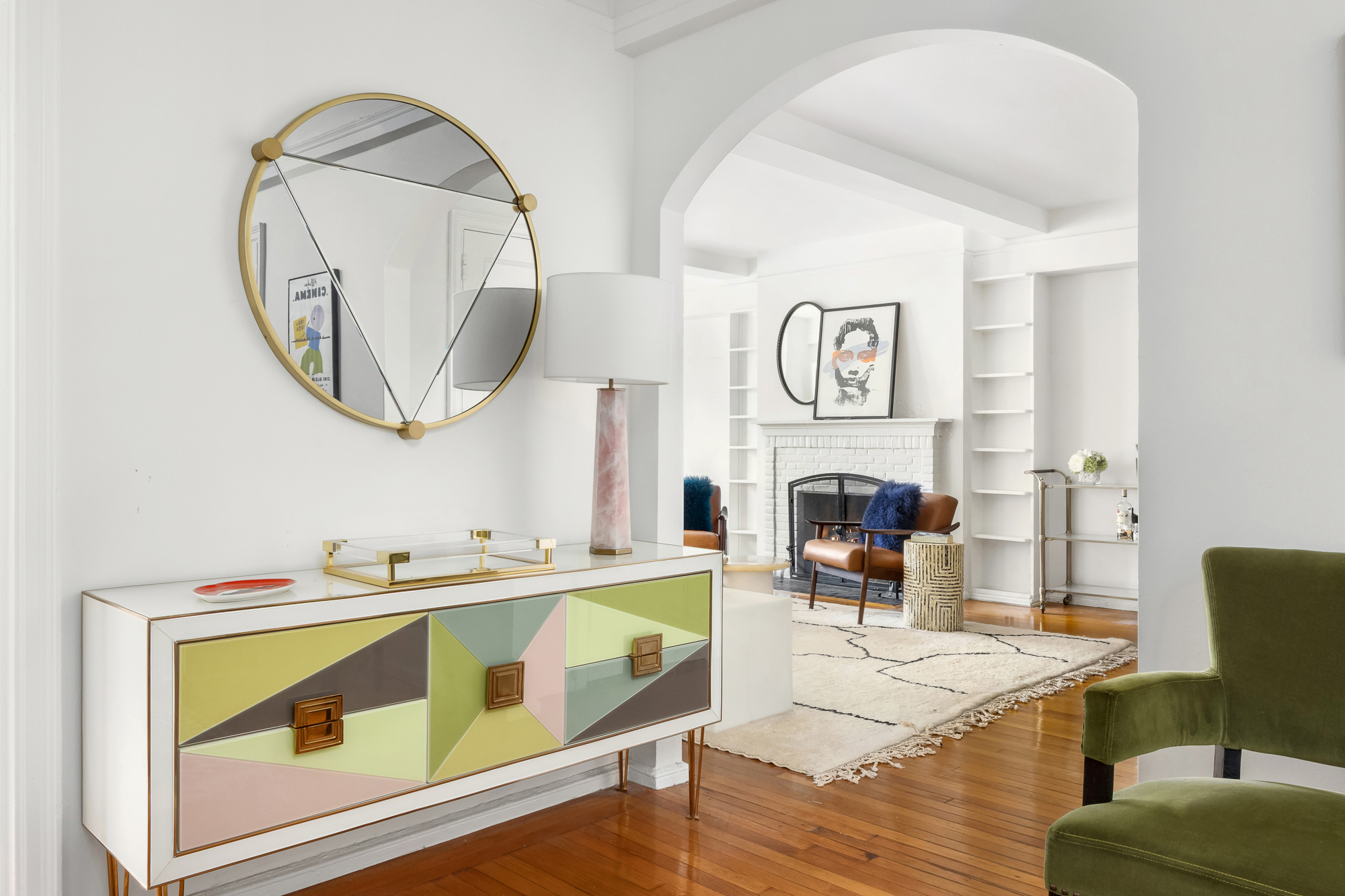 45 Christopher Street, Unit 3C Manhattan, NY 10014 - Photo 5 of 11 a living room with furniture a fireplace and a table