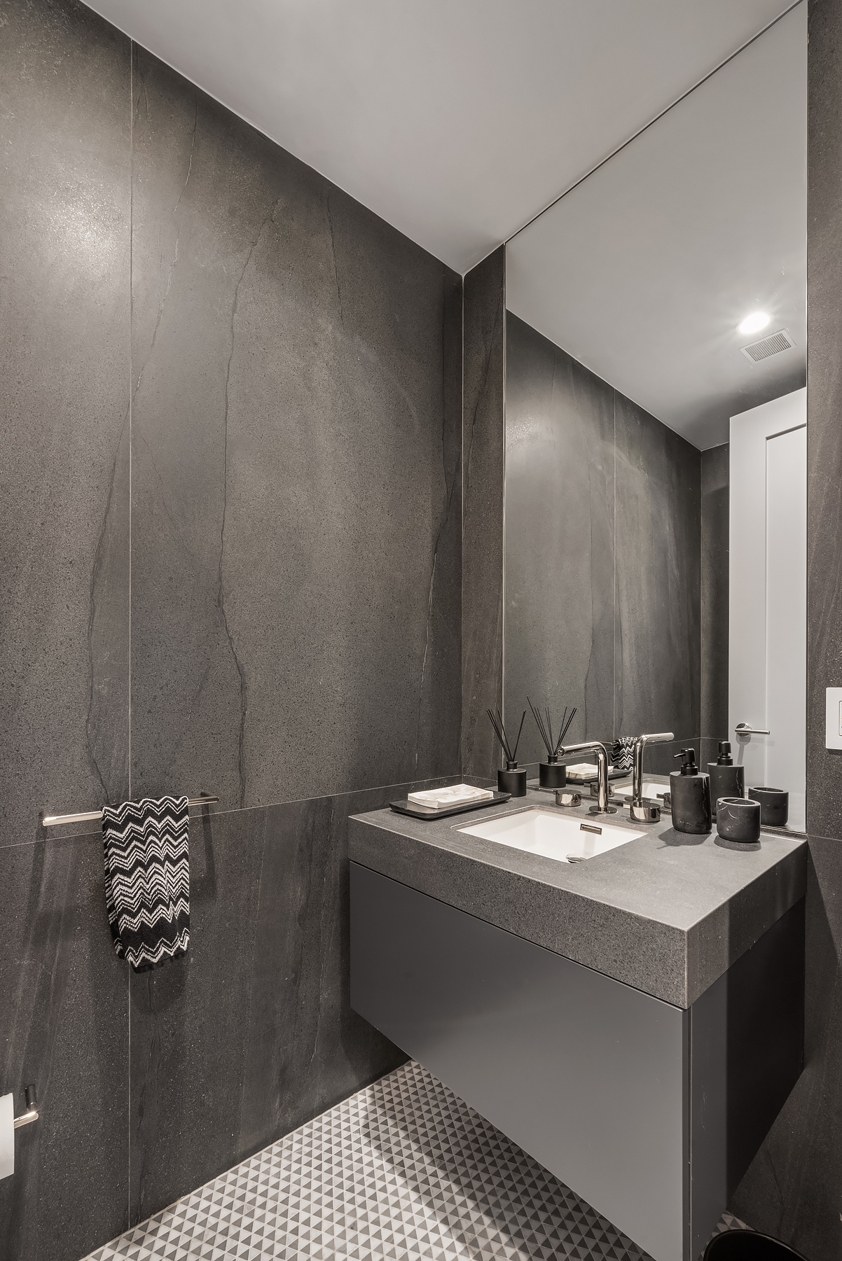 1059 3rd Avenue, Unit 18B Manhattan, NY 10065 - Photo 10 of 11 a bathroom with a sink and a mirror