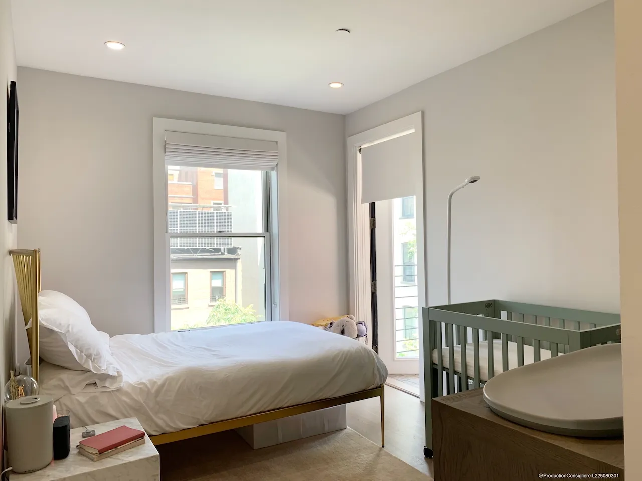 a bedroom with a bed and a table