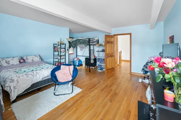 a living room with furniture and flowers