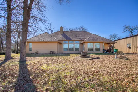 a view of a large house with a yard