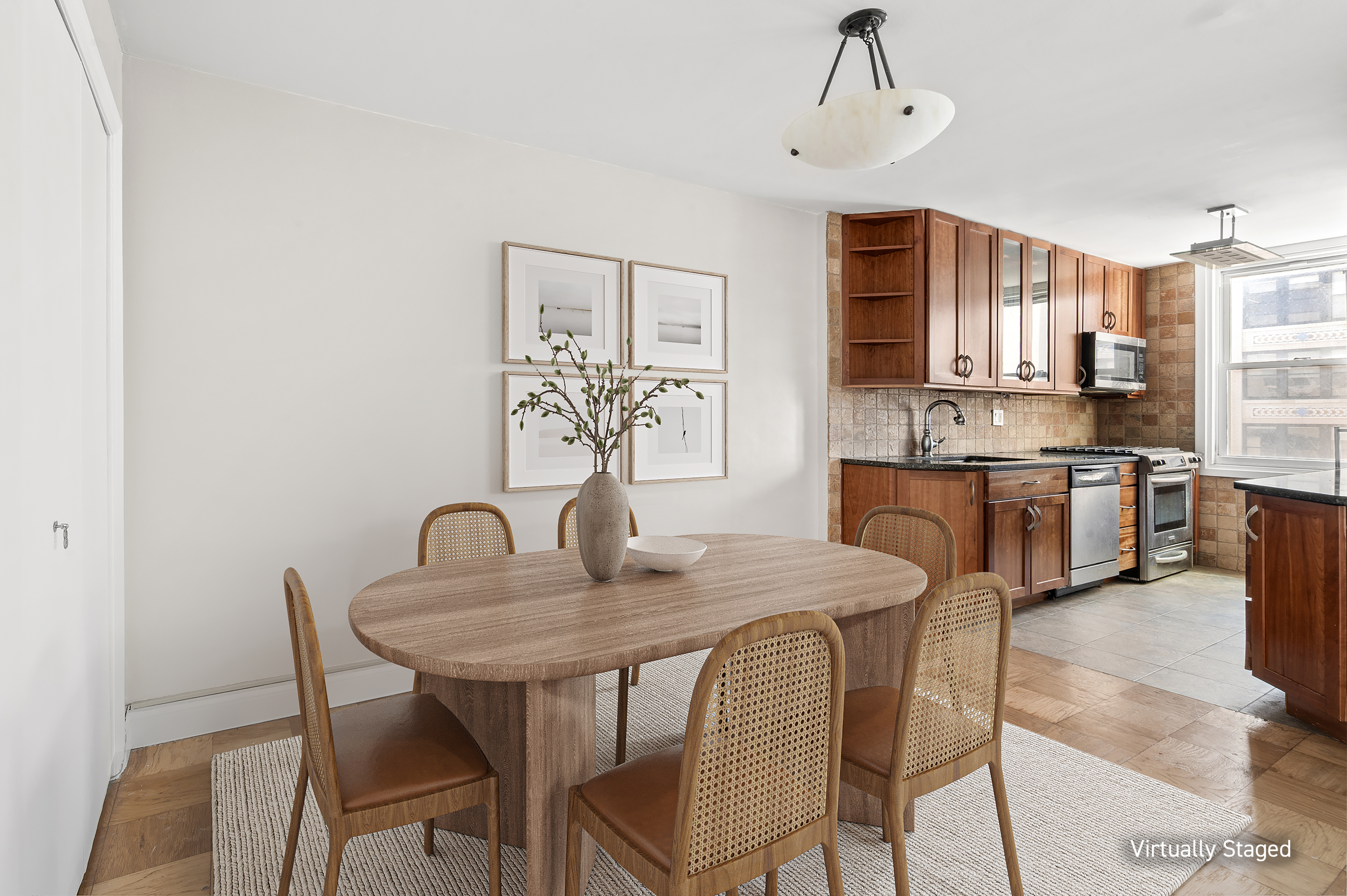 77 7th Avenue, Unit 10N Manhattan, NY 10011 - Photo 3 of 13 a dining room with furniture and window