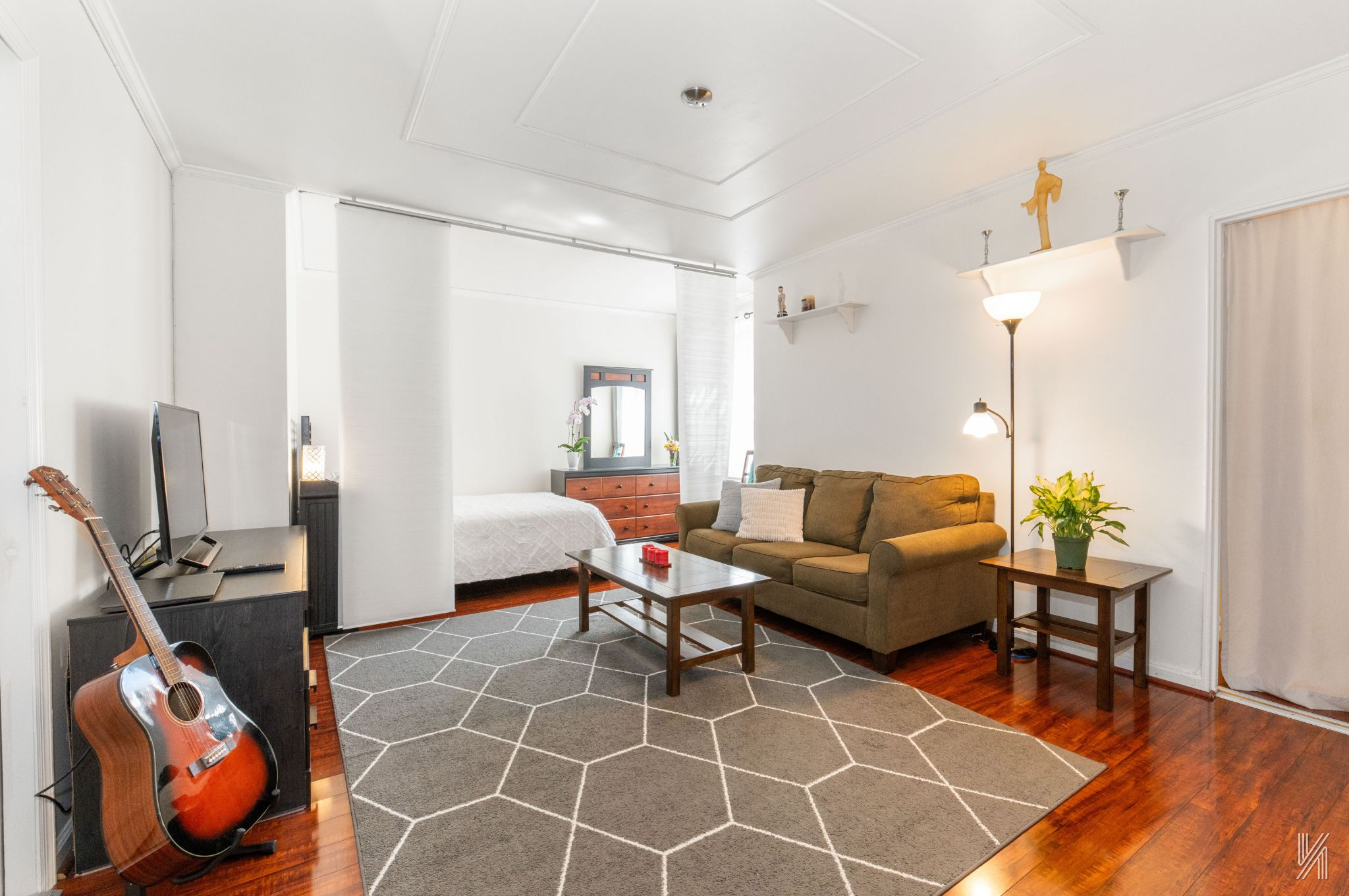 39-30 52nd Street, Unit 5E Queens, NY 11377 - Photo 1 of 15 a living room with furniture a table and a potted plant
