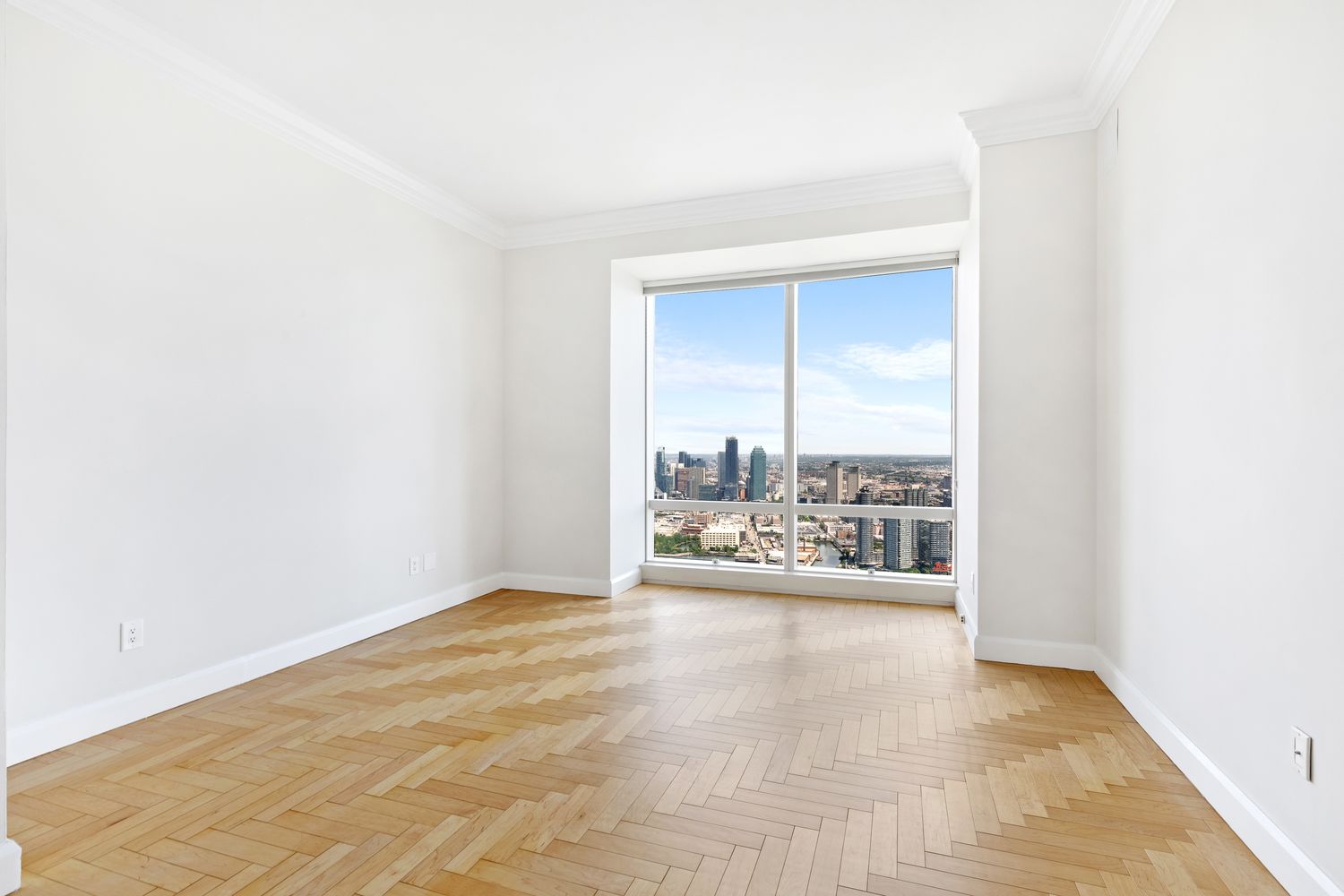 845 United Nations Plaza, Unit 63B Manhattan, NY 10017 - Photo 9 of 14 a view of a room with a floor to ceiling window
