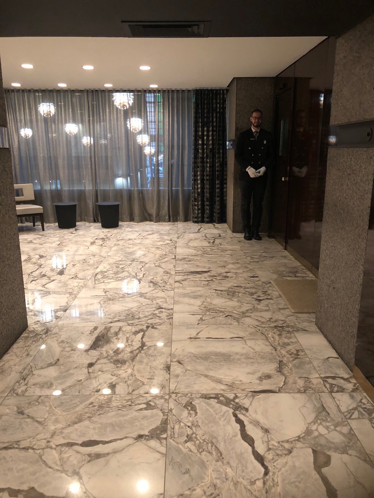 117 East 57th Street, Unit 21H Manhattan, NY 10022 - Photo 21 of 26 a bathroom with a sink and a shower