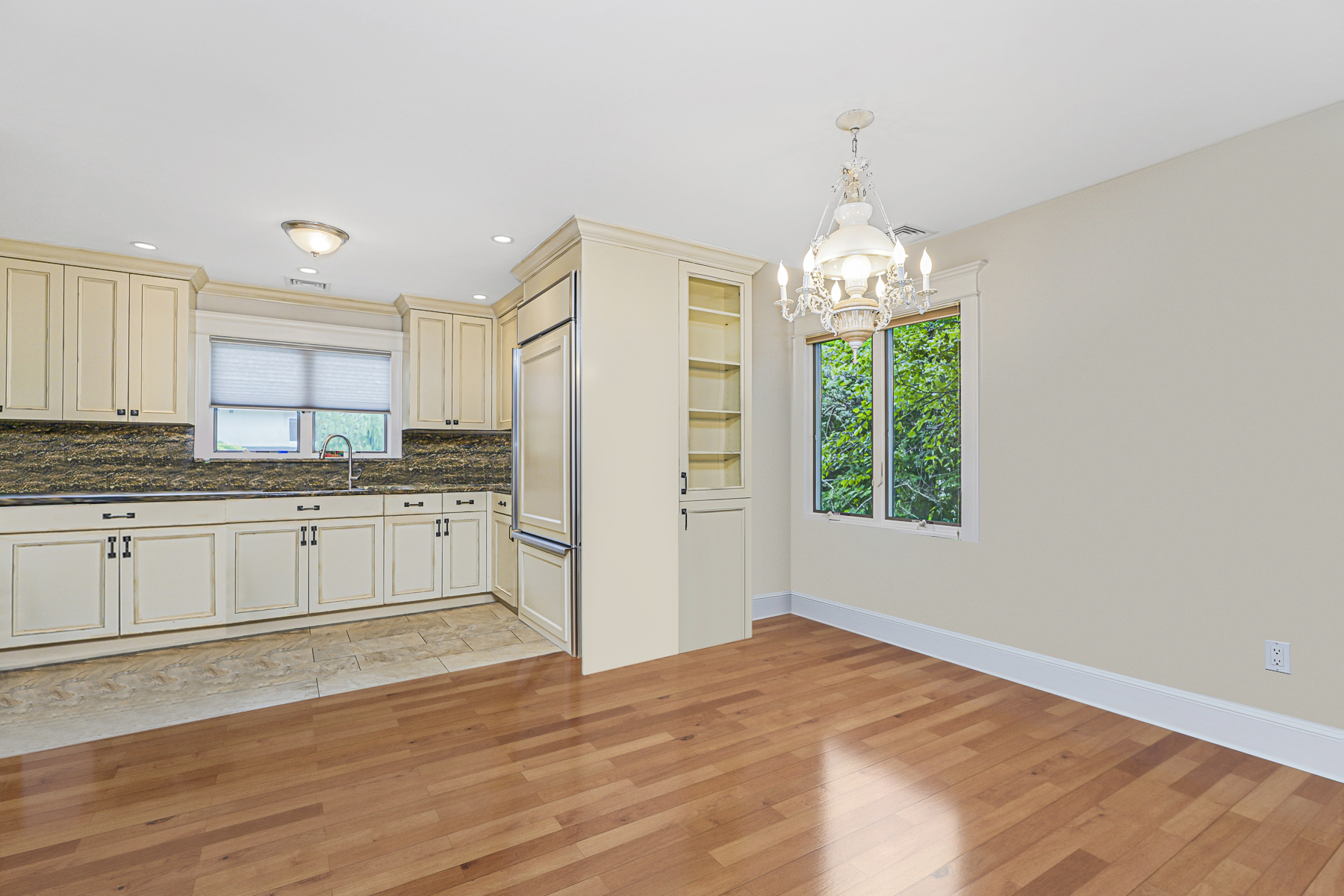 165 Swaim Avenue Staten Island, NY 10312 - Photo 33 of 45 a kitchen with granite countertop a refrigerator and white cabinets