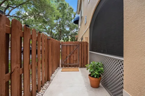 a view of a entryway with flower plants