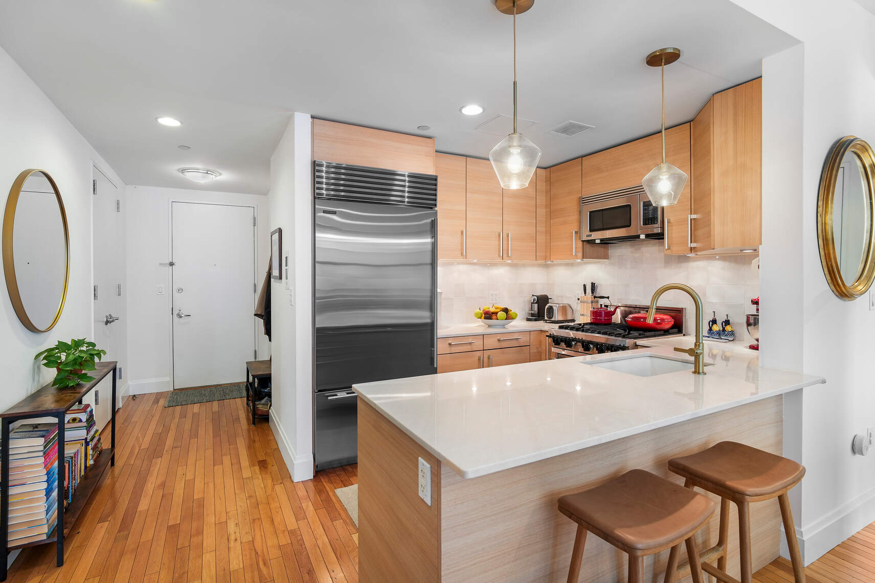 199 State Street, Unit 5C Brooklyn, NY 11201 - Photo 4 of 16 a kitchen with kitchen island a counter space a sink appliances and cabinets