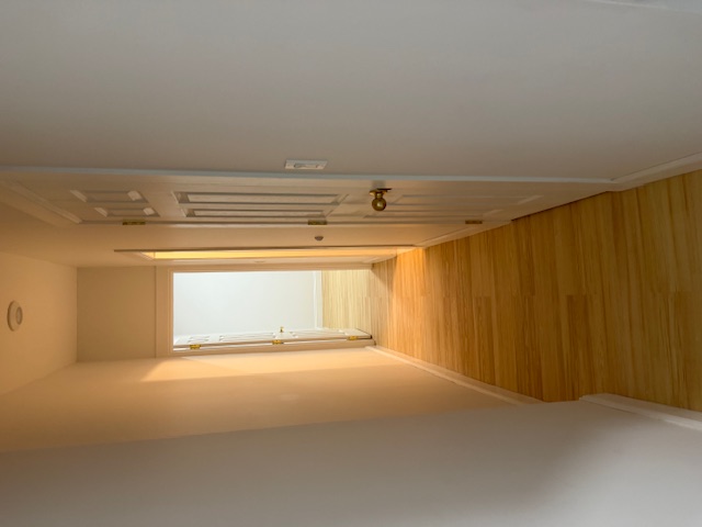 552 West 141st Street, Unit 1A Manhattan, NY 10031 - Photo 3 of 4 a view of a hallway with wooden floor and a bathroom