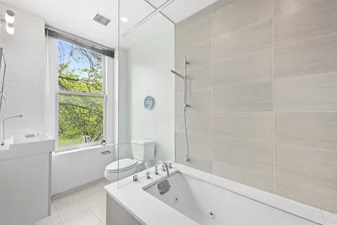 a bathroom with a sink a bathtub and shower