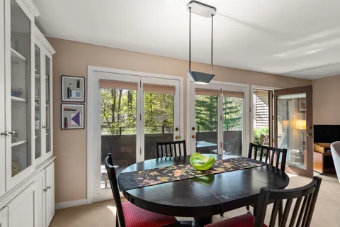 a view of a dining room with furniture window and outside view