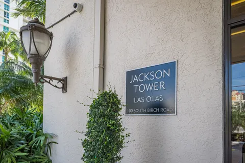 a sign that is on a brick wall