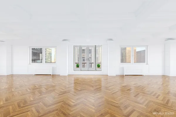 a view of an empty room with a window