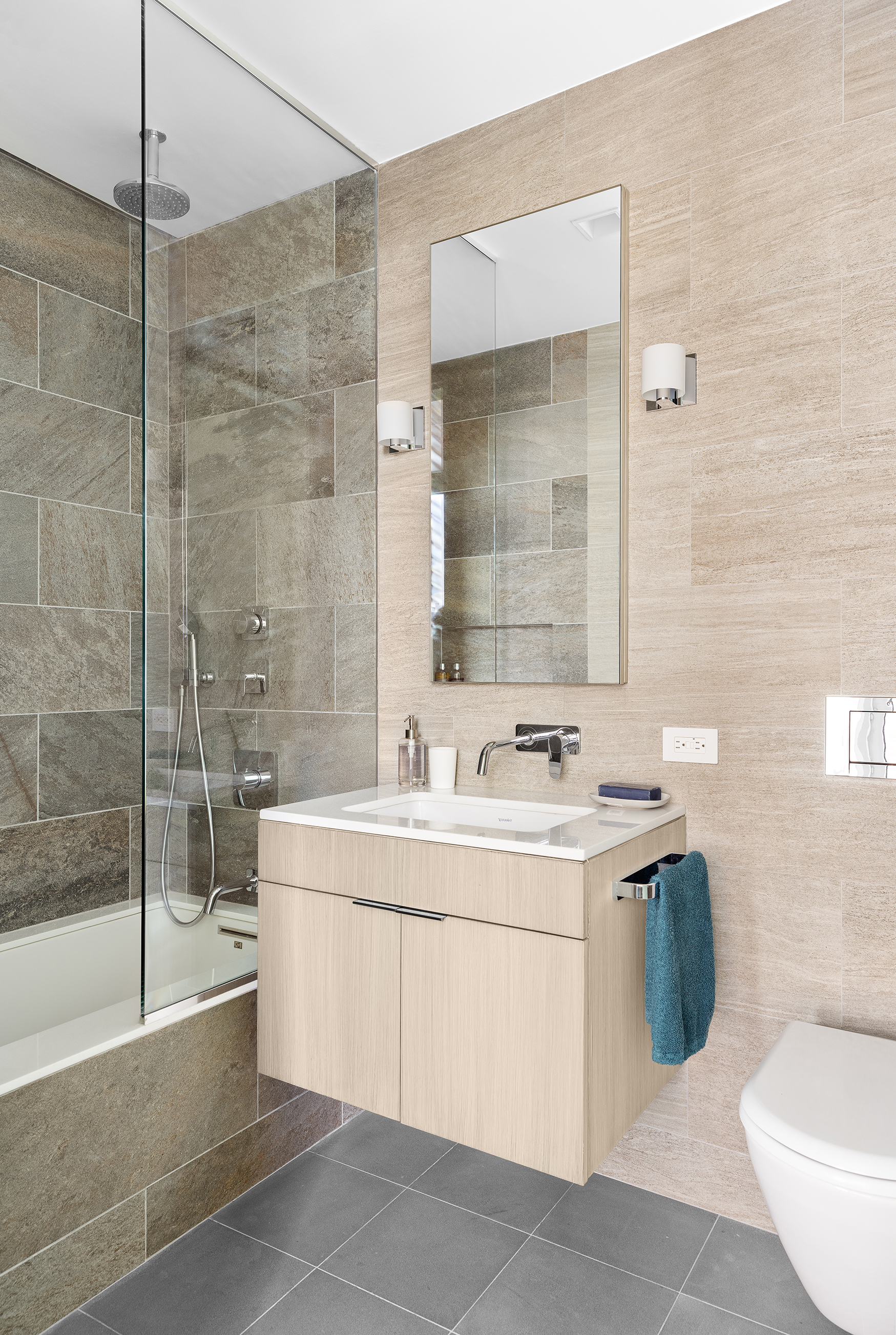 57 Irving Place, Unit PH9/10 Manhattan, NY 10003 - Photo 26 of 33 a bathroom with a sink toilet and shower