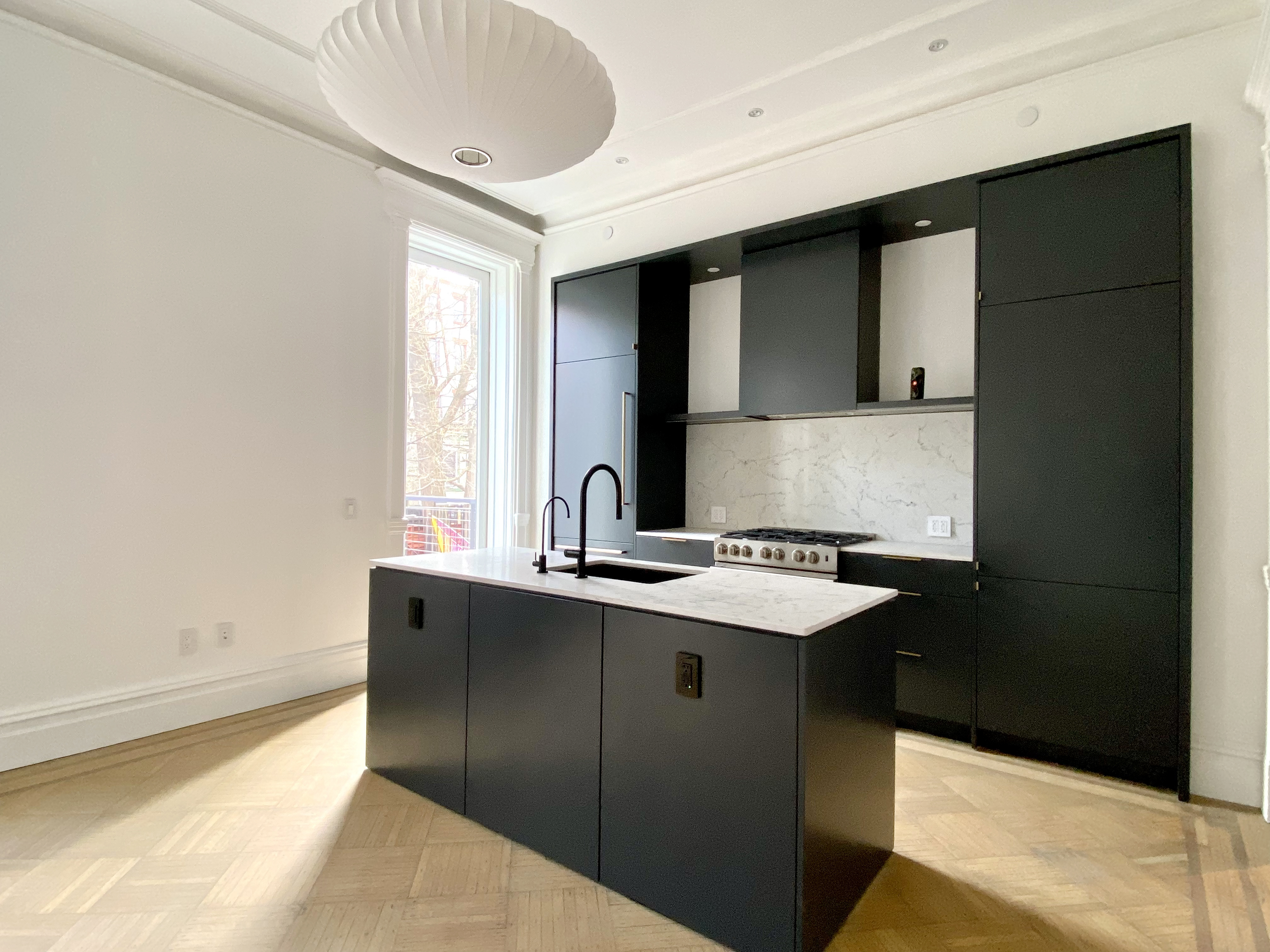 1420 Pacific Street, Unit 1 Brooklyn, NY 11216 - Photo 2 of 30 a kitchen with a sink and a refrigerator