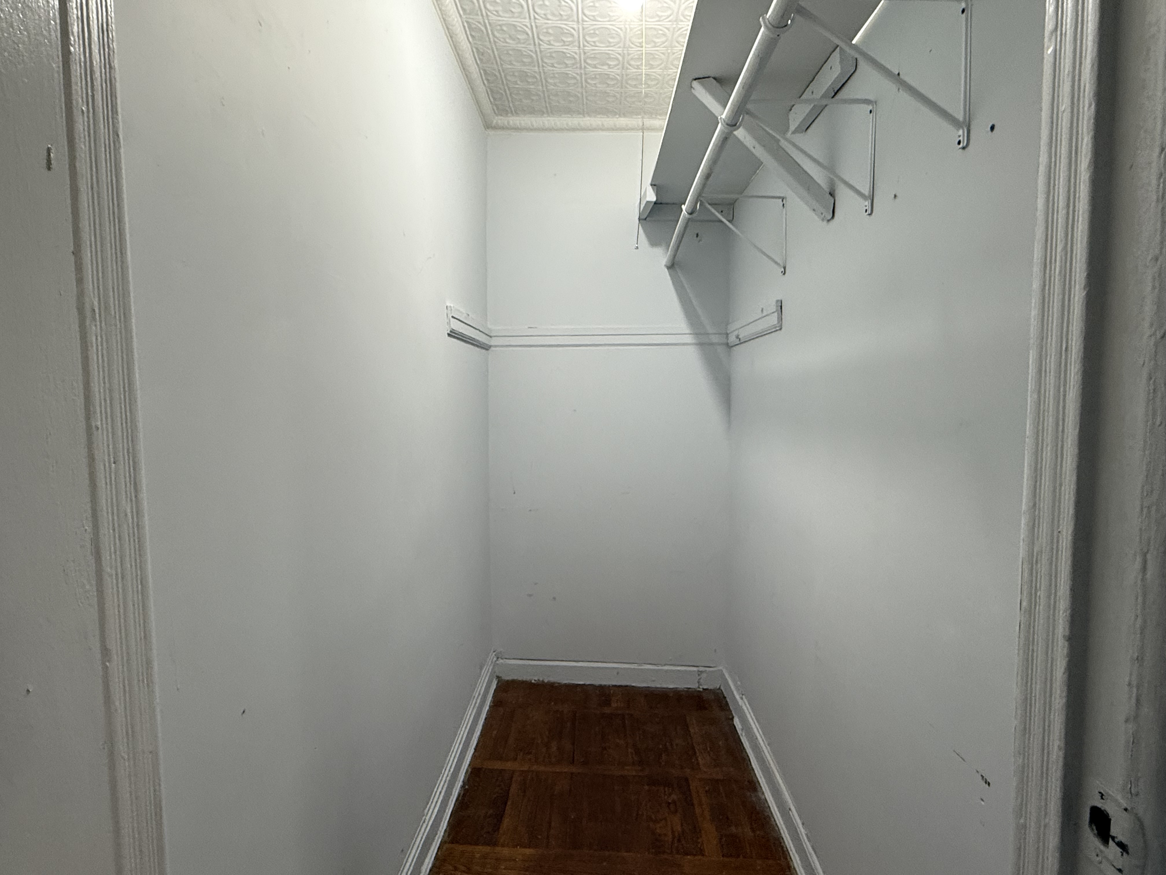 149 7th Avenue, Unit 4 Brooklyn, NY 11215 - Photo 5 of 9 a view of a room with racks on the wall