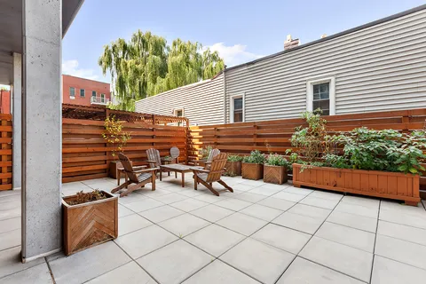 a view of a terrace with sitting area