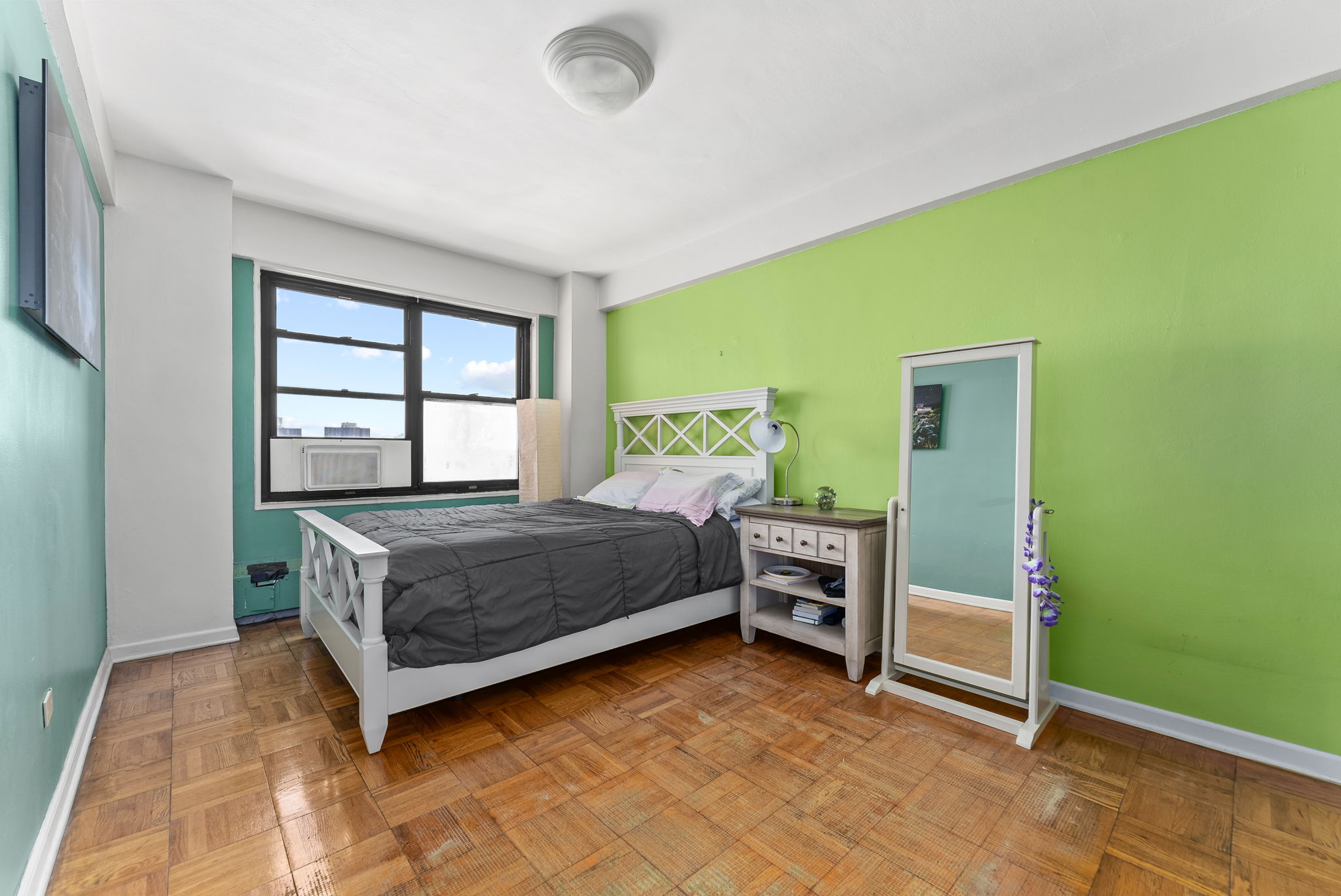 345 West 145th Street, Unit 11B2 Manhattan, NY 10031 - Photo 3 of 9 a bedroom with a bed and a window