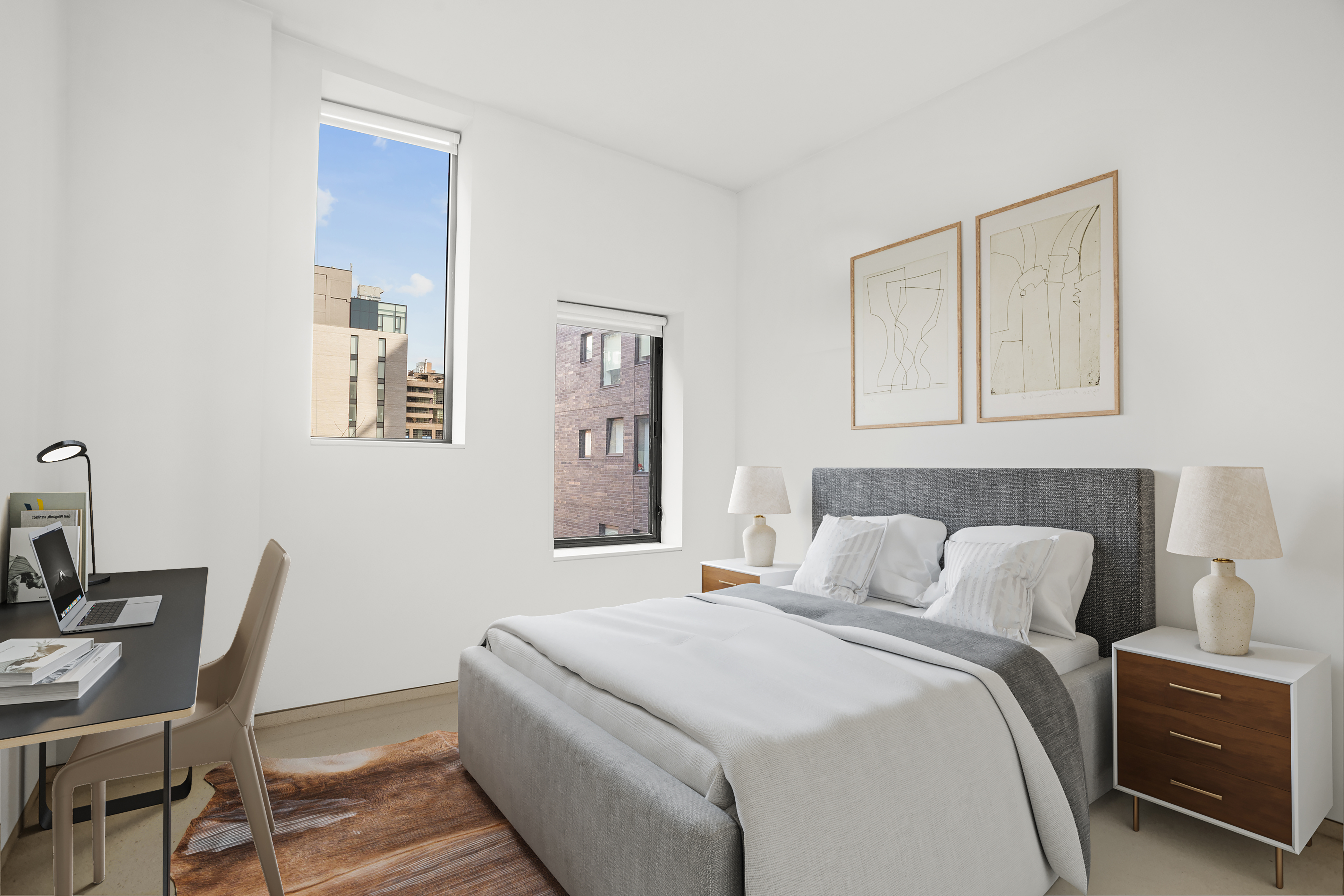 100 11th Avenue, Unit 5A Manhattan, NY 10011 - Photo 6 of 20 a bedroom with a bed and a table in it