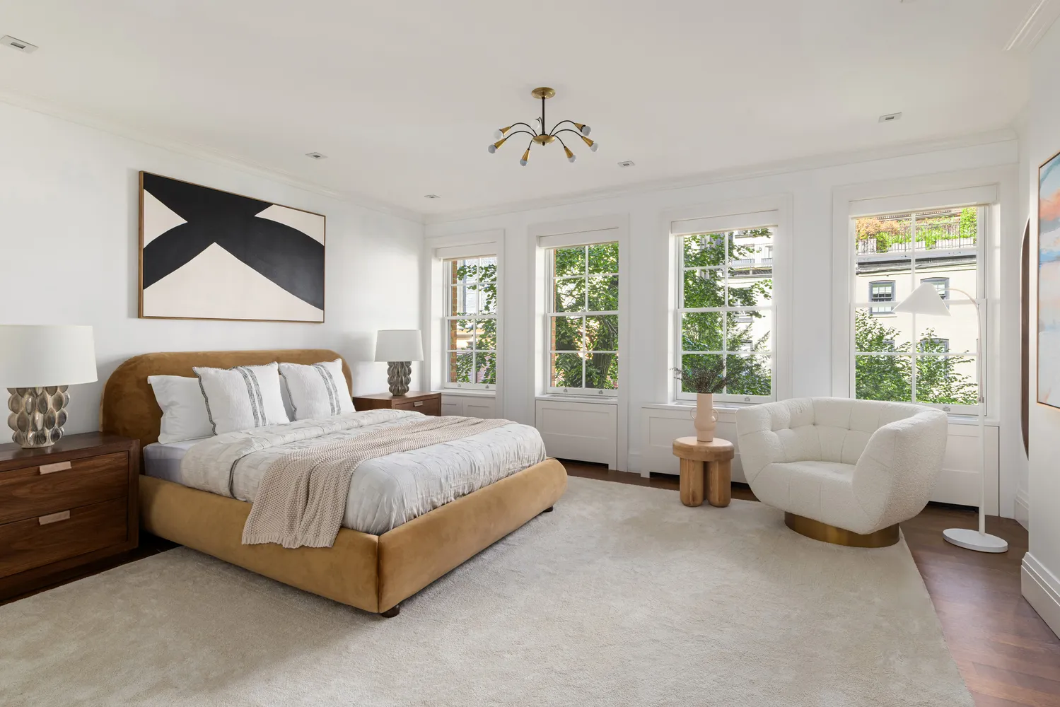 a spacious bedroom with a bed and a couch