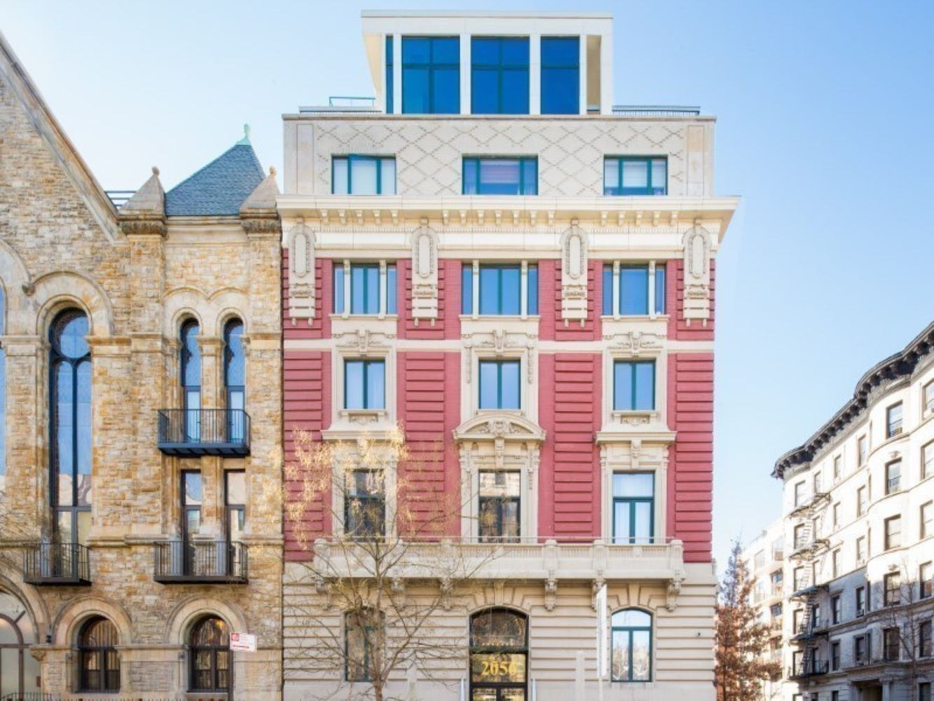 2056 5th Avenue, Unit 2B Manhattan, NY 10035 - Photo 9 of 13 a front view of a building with glass windows