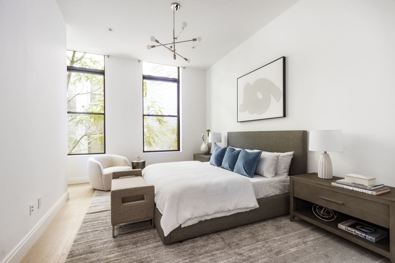 106 Franklin Street, Unit PH Manhattan, NY 10013 - Photo 5 of 13 a bedroom with a bed and wooden floor