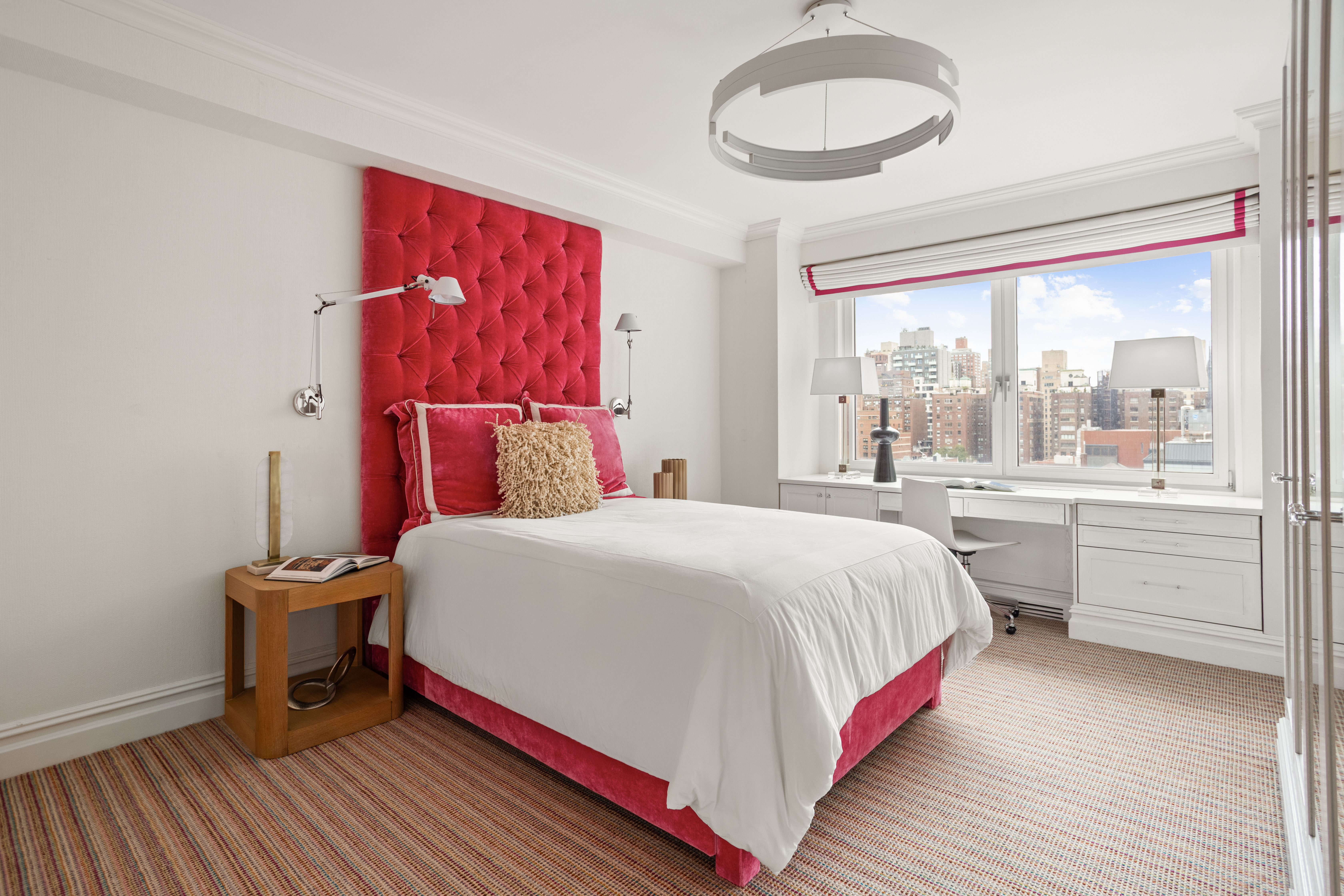 60 East End Avenue, Unit 12C Manhattan, NY 10028 - Photo 12 of 27 a bedroom with a bed and a window