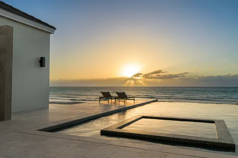 a view of swimming pool with furniture