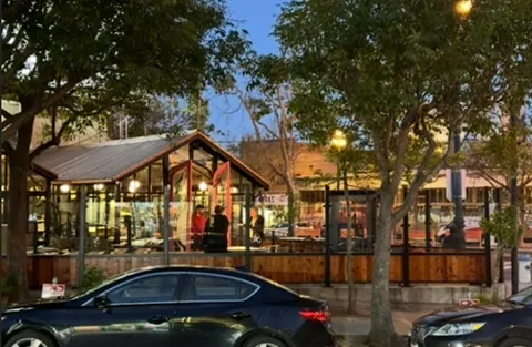 a view of a chairs and table in a patio